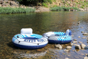 Wind down in this 2 Bed Oasis with River Access Hot Tub and Outdoor Fun Sleeps 6 Comfortably